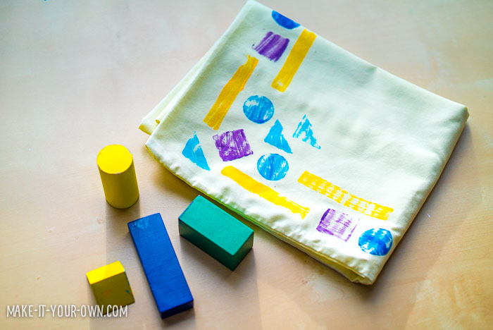 Stamping with Blocks with make-it-your-own.com (Crafts & activities for kids) *This is a great trick to hide stains!