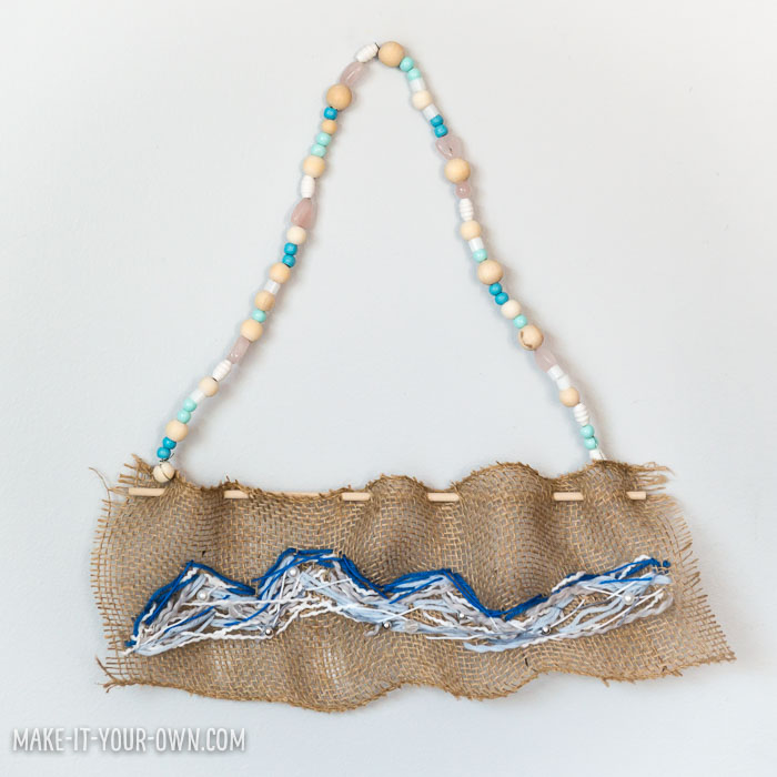 Create a wave sewing on burlap, inspired by The Great Wave off Kanagawa 