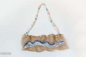 Create a wave sewing on burlap, inspired by The Great Wave off Kanagawa