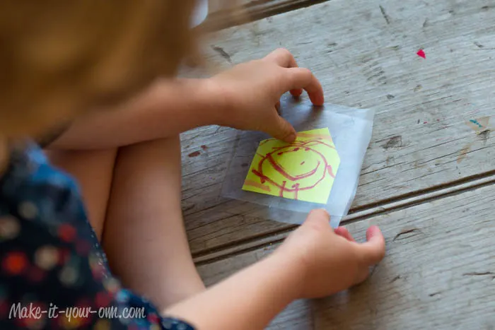 Kid Artwork Mobile: Applying Contact Paper from make-it-your-own.com