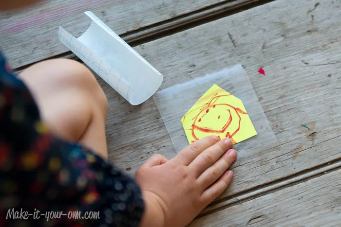 Kid Artwork Mobile: Covering with Contact Paper from make-it-your-own.com