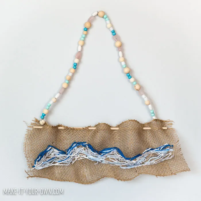Create a wave sewing on burlap, inspired by The Great Wave off Kanagawa