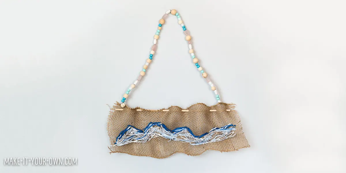 Create a wave sewing on burlap, inspired by The Great Wave off Kanagawa
