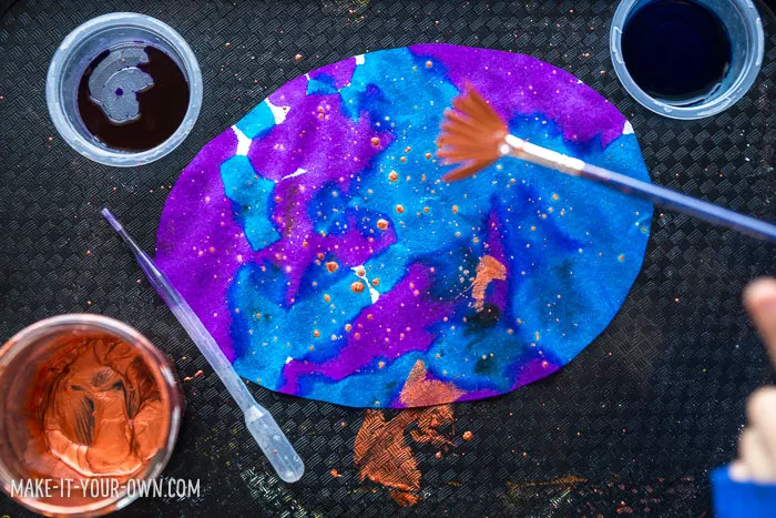 Children in Preschool, Kindergarten and School age will enjoy this painting activity which incorporates pipette painting and splatter painting to make an EASTER EGG GARLAND that would make a beautiful sun catcher!